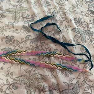 Beaded choker or bracelet with blue ribbon